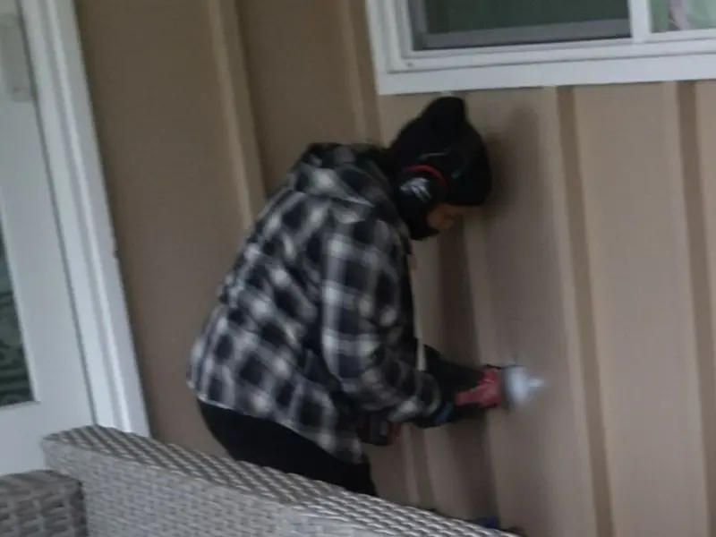 Professional electrician installing an exterior outlet in Lynnwood